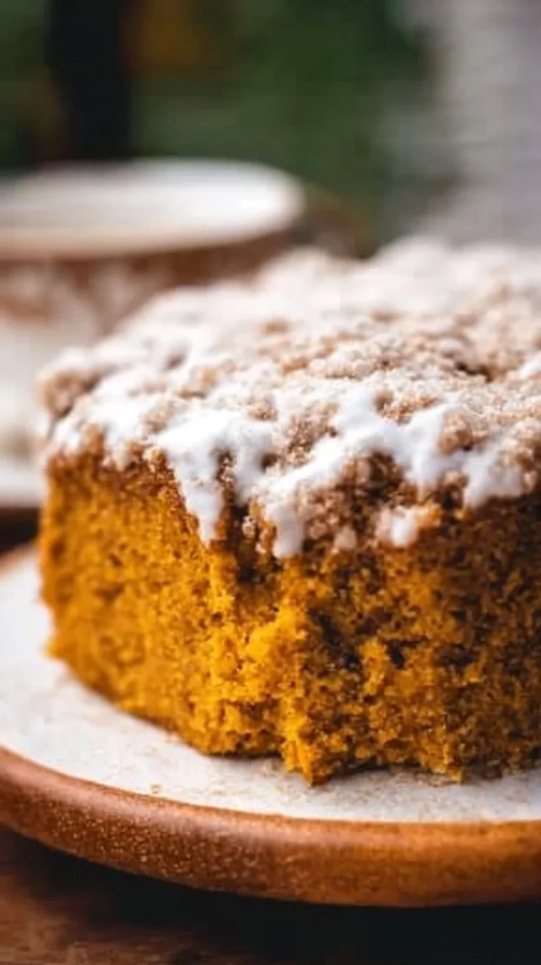 Delicious Pumpkin Coffee Cake served with coffee and decorative fall elements