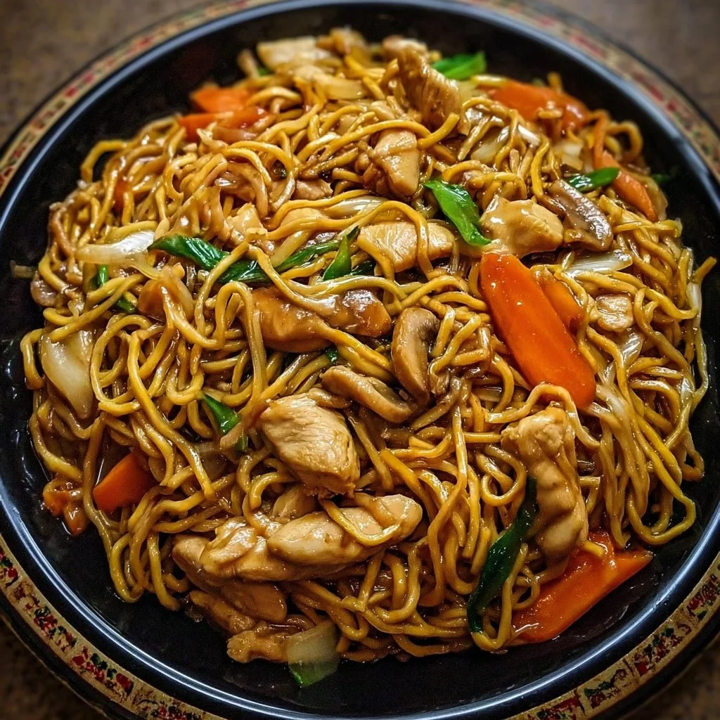 Delicious homemade Chicken Lo Mein served in a bowl with vegetables and sauce