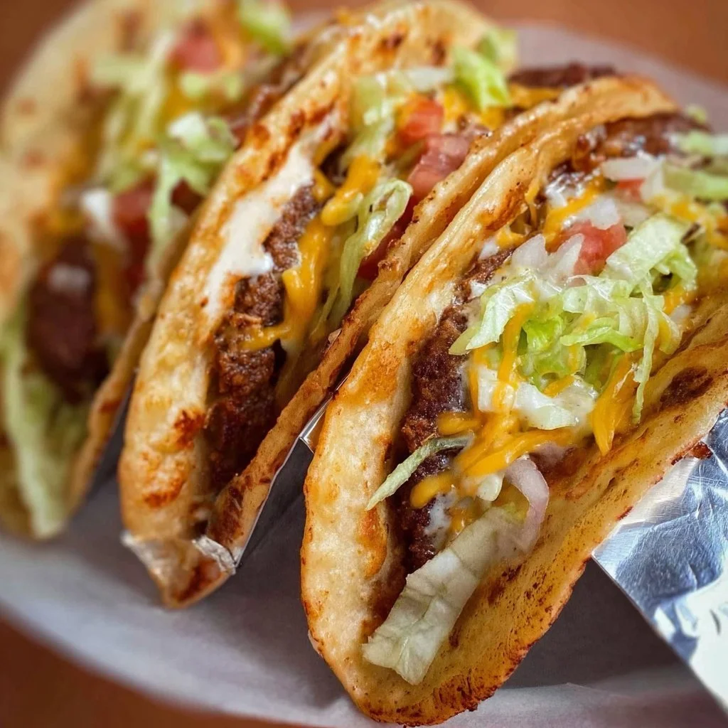 Delicious smash burger tacos served with fresh toppings and sauces.